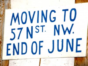 Sign showing a move to a new location